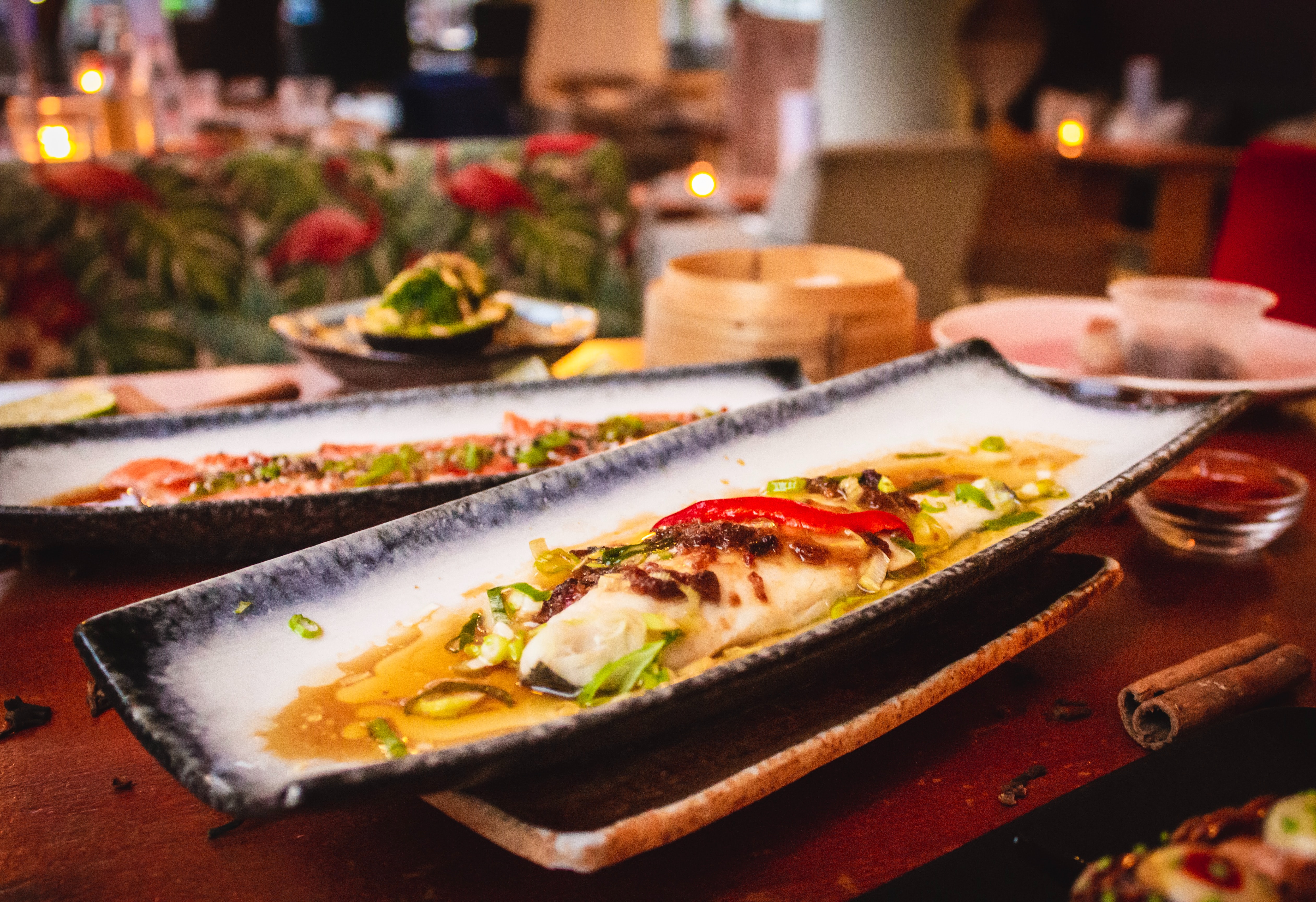 long plate with fish fillet, leek and red bell-pepper